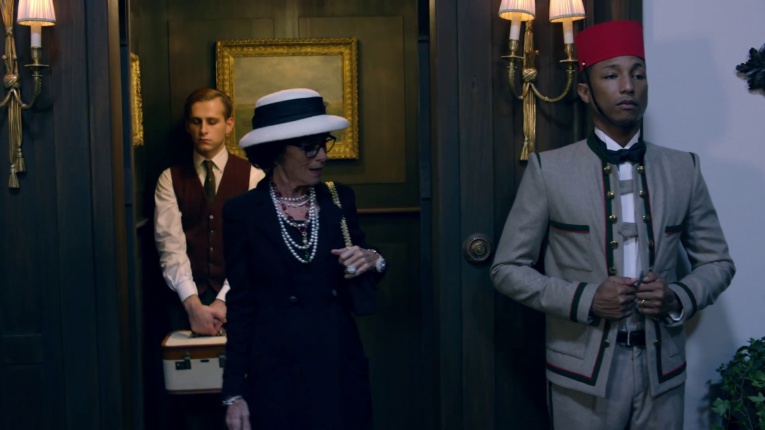A lift boy's (Pharrell Williams) uniform inspires Coco Chanel (Geraldine Chaplin) to create the famous Chanel jacket